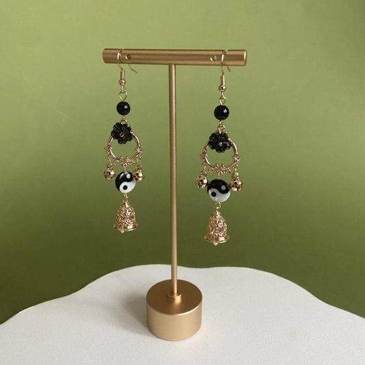 Yin and Yang earrings — close-up of yin-yang pendant detail