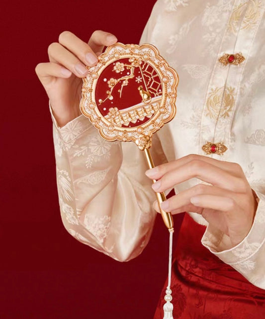 Palace Snow handheld mirror — handle and frame detail view